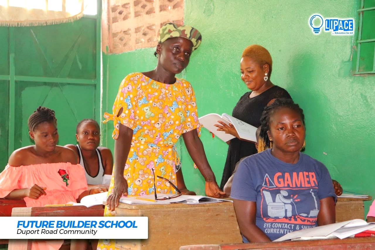An instructor helping a learner with their writing