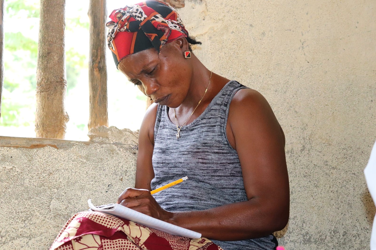 A teacher assisting a student with schoolwork